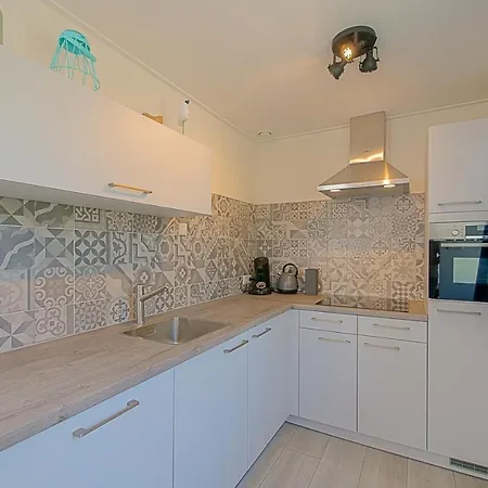 펜션 Familiehuis Noordenwind - Aan Zee 줄리아나도르프